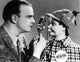 Edgar Bergen Checking Puppet's Face with Magnifying Glass Photo Print