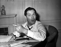 Milton Berle sitting at his desk - Photo Print