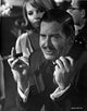 Milton Berle holding a cigar photo print, classic entertainment icon.