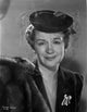 Rosemary Decamp posed with net hat photo print.