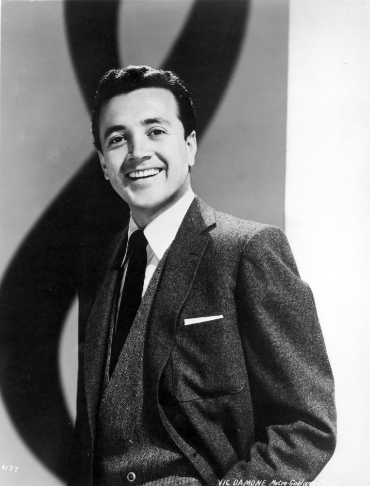 Vic Damone smiling in a black suit photo print