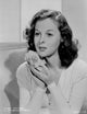 Susan Hayward posed with a rose photo print, classic Hollywood art.