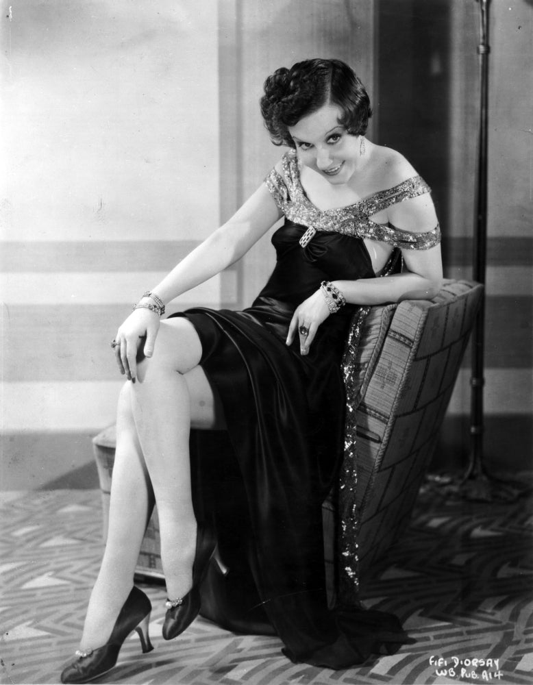 Fifi Dorsay seated on chair in elegant dress photo print
