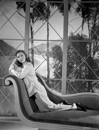 Susan Hayward leaning on a chair in a white blouse photo print