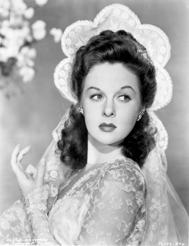 Susan Hayward wearing an embroidered dress with veil photo print.