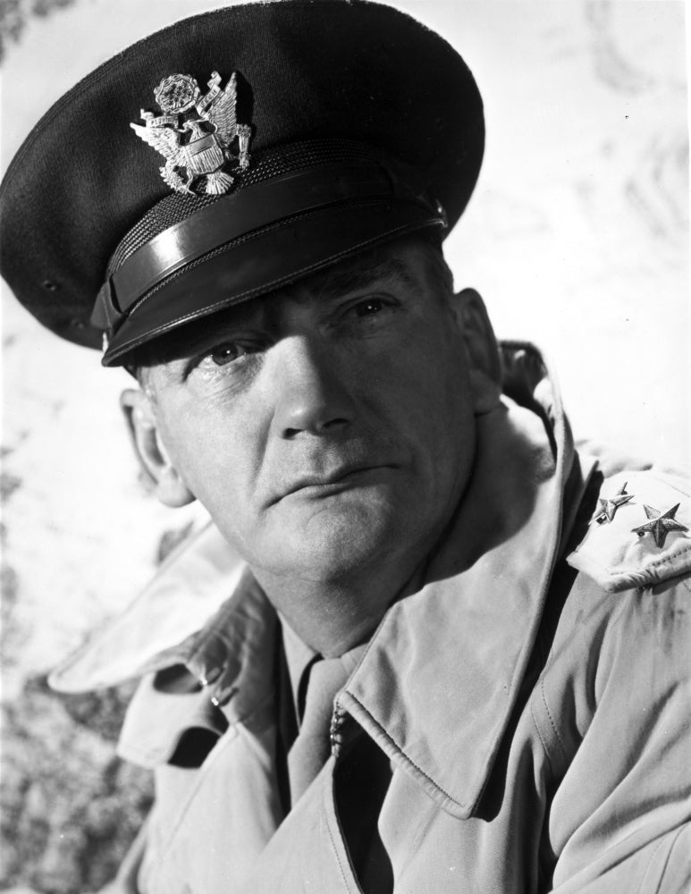 Millard Mitchell posed in police attire photo print with white background.