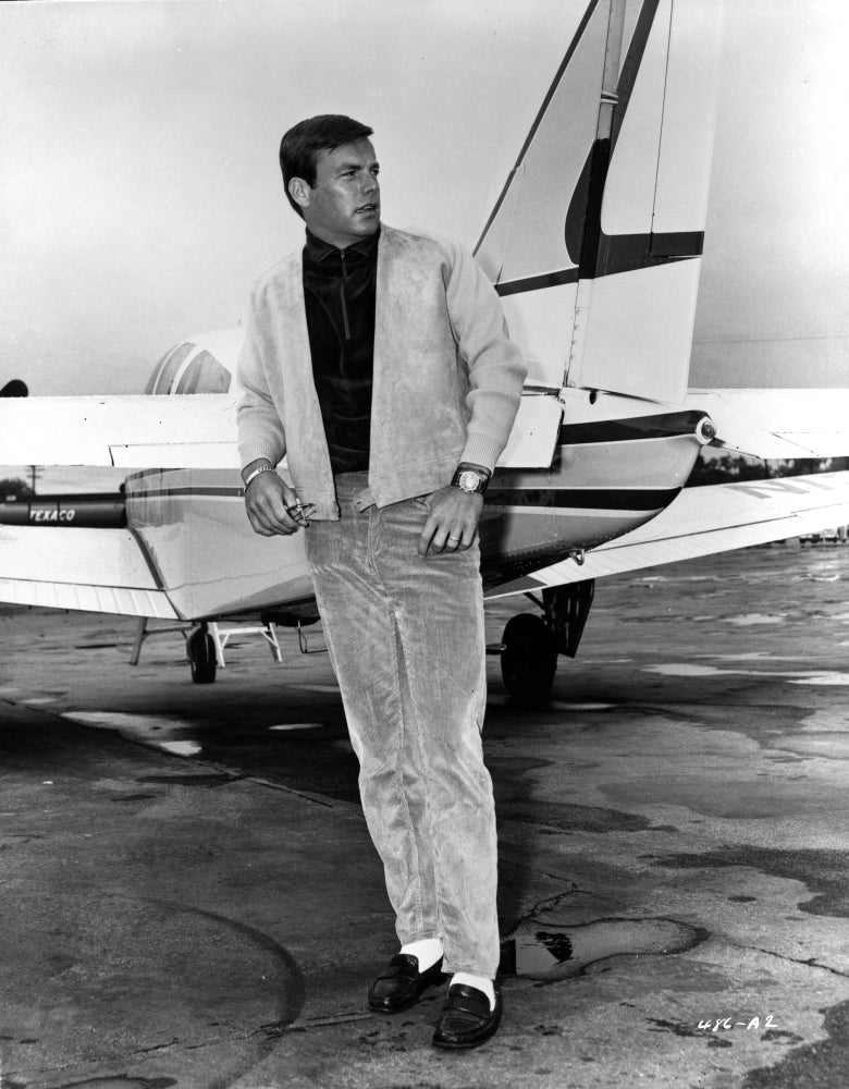 Robert Wagner photo print featuring the actor by an airplane.
