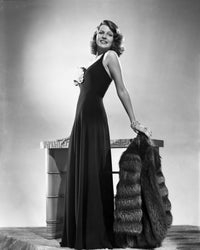 Rita Hayworth posed in a stylish black dress photo print.