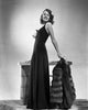 Rita Hayworth posed in a stylish black dress photo print.