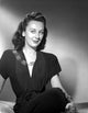 Ann Dvorak Sitting Portrait Photo Print in dark dress