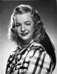 Dale Evans Winking Eye Portrait Photo Print featuring checkered background.