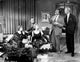 Book Bell movie cast members in living room scene photo print.