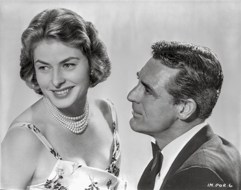 Indiscreet Couple Photo Print featuring a lady in a printed dress and a man in a suit.
