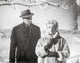 Imitation Of Life photo print featuring a lady in a furry coat and a man in a black suit with hat.