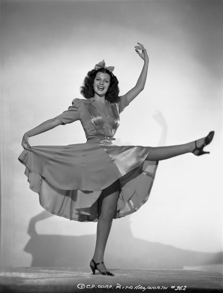 Rita Hayworth in dancing pose photo print, vintage Hollywood glamour.