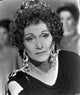 Sian Phillips portrait photo print leaning sideways against a dark background.