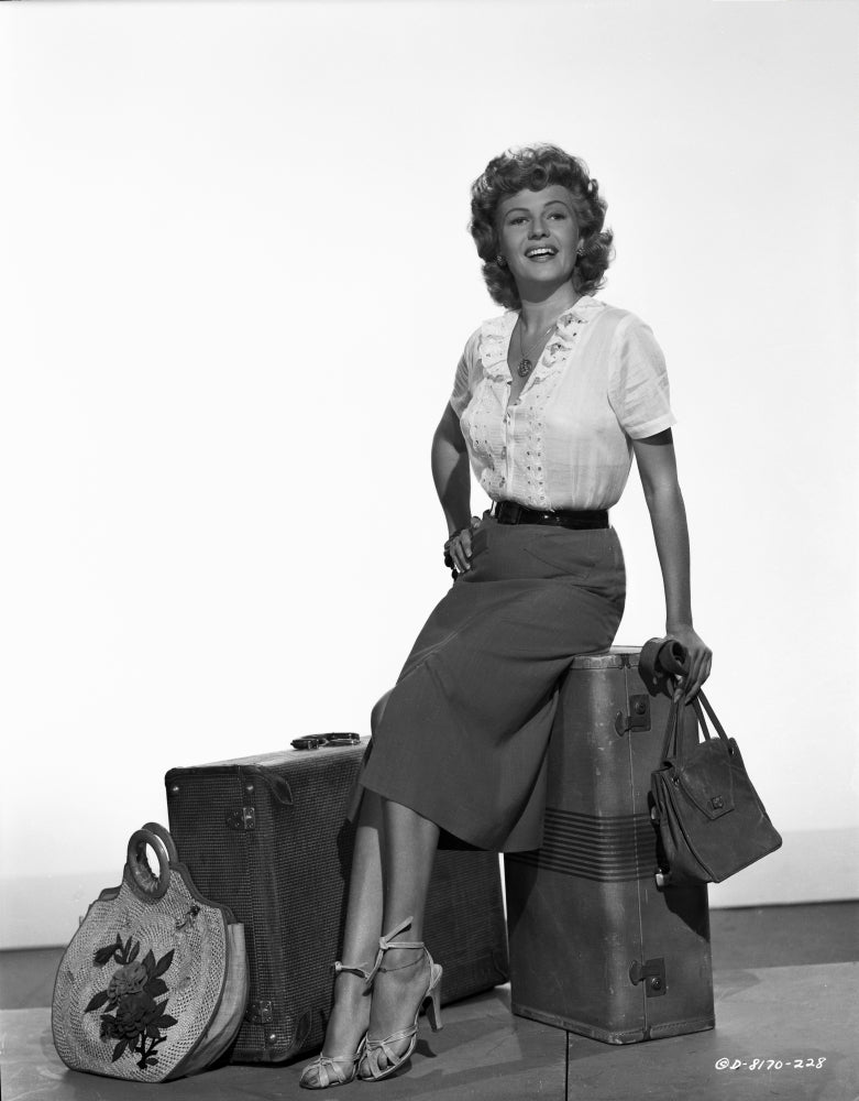Rita Hayworth sitting pose photo print, classic Hollywood art.