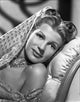 Rita Hayworth wearing a veil in a charming pose photo print