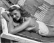 Rita Hayworth smiling and sunbathing photo print