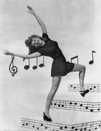 Rita Hayworth bending pose photo print with musical notes background.