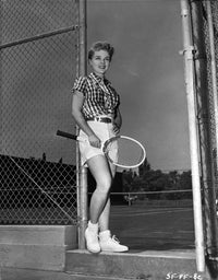 Sally Forrest Tennis Photo Print featuring classic sports attire with racket