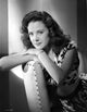 Elegant portrait of Carol Forman in a printed dress, photo print.
