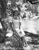 Rita Hayworth vintage photo print posed by a tree