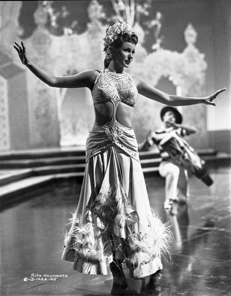 Rita Hayworth Dancing Pose Photo Print showcasing classic Hollywood elegance.