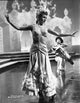 Rita Hayworth Dancing Pose Photo Print showcasing classic Hollywood elegance.
