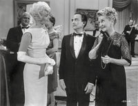 Pillow Talk scene photo print of people in formal outfits engaged in conversation.