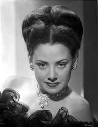 Carol Forman in a ruffled lace gown with necklace and earrings photo print.