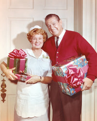 Hazel's joyful pose with Christmas presents photo print