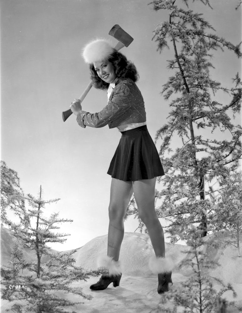 Carol Forman posed in winter attire with an axe photo print