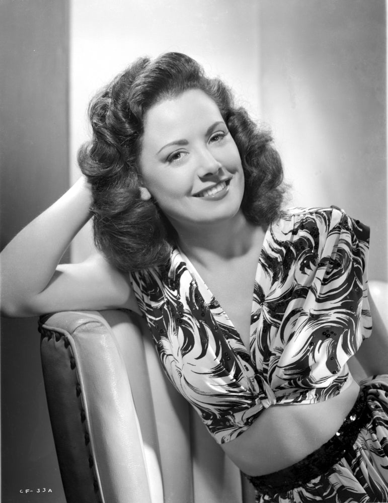 Photo Print of Carol Forman in Printed Dress with Hand on Face