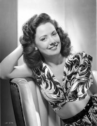 Photo Print of Carol Forman in Printed Dress with Hand on Face