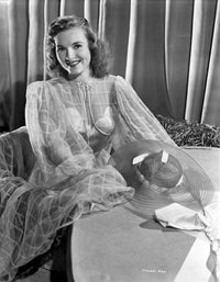 Photo print of Susanna Foster wearing a see-through dress
