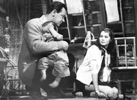 World Of Suzie photo print of a man and woman talking with child