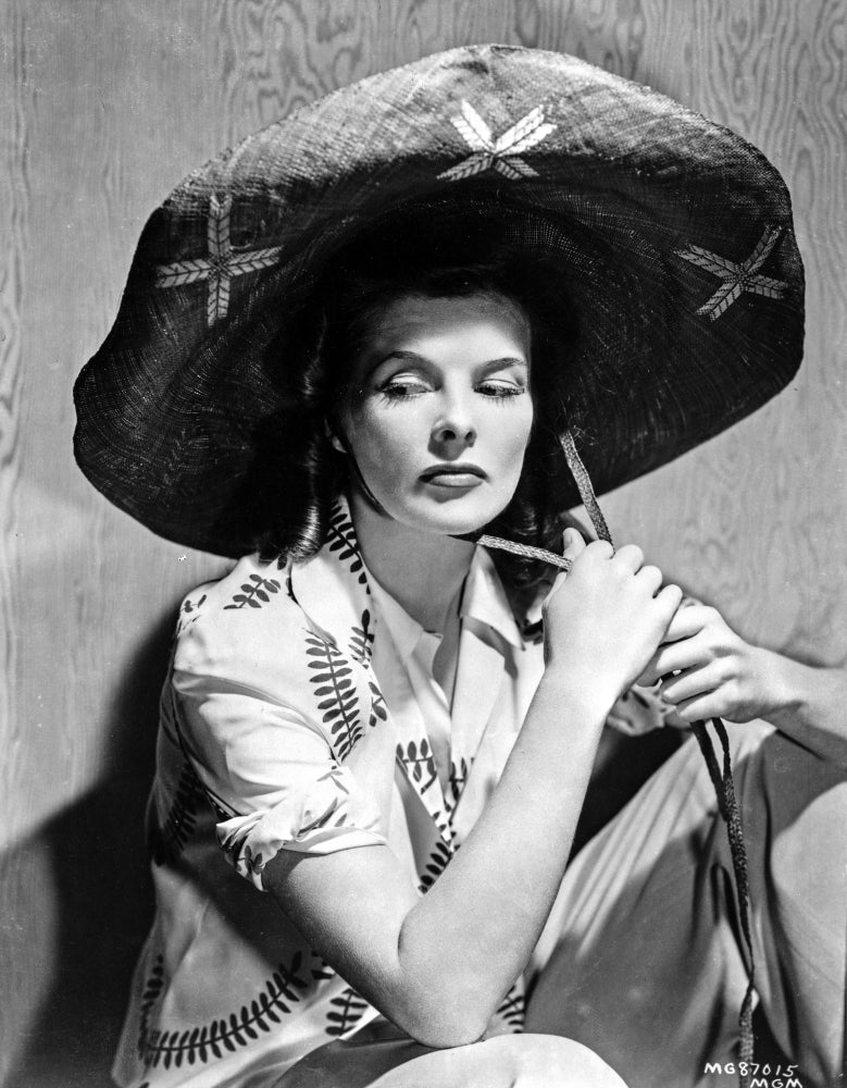 Black and white photo print of Katharine Hepburn wearing a black hat.