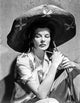 Black and white photo print of Katharine Hepburn wearing a black hat.