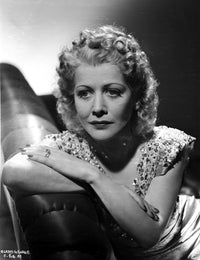 Gladys George photo print leaning on a beaded top couch.