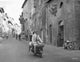 Rome Adventure photo print featuring a man in a suit riding a scooter with a woman.