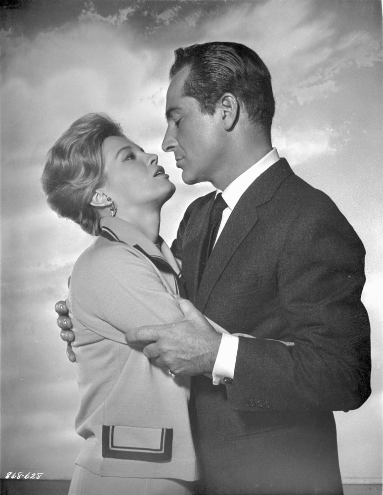 Rome Adventure photo print depicting a man in a suit holding a woman's arms.