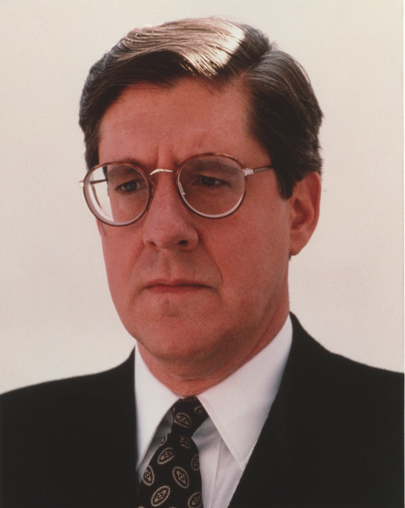 Edward Herrmann posed in formal suit and glasses photo print