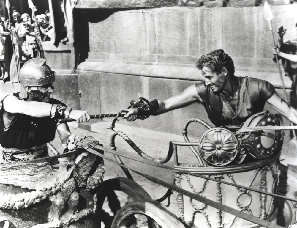 Black and white photo print of Charlton Heston in a horse-drawn vehicle