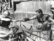 Black and white photo print of Charlton Heston in a horse-drawn vehicle