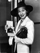 Sigrid Gurie holding a box of perfume photo print