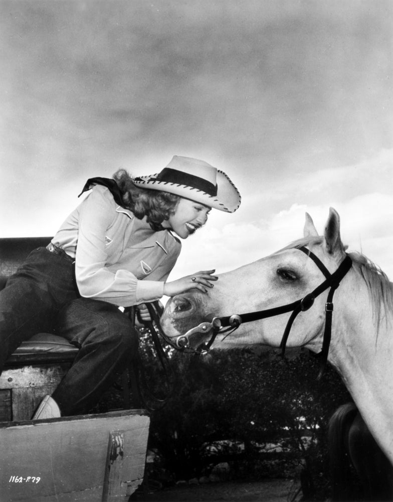 Portrait of Anne Gwynne with a horse, classic Hollywood photo print.