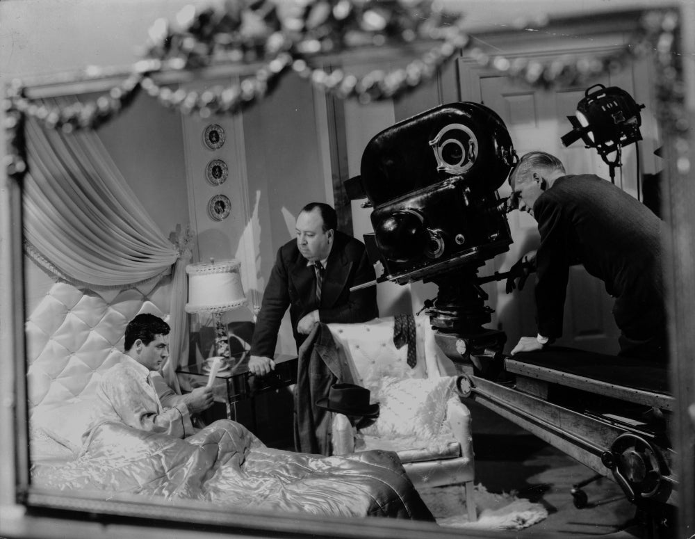 Alfred Hitchcock Filming a Man on Bed Photo Print