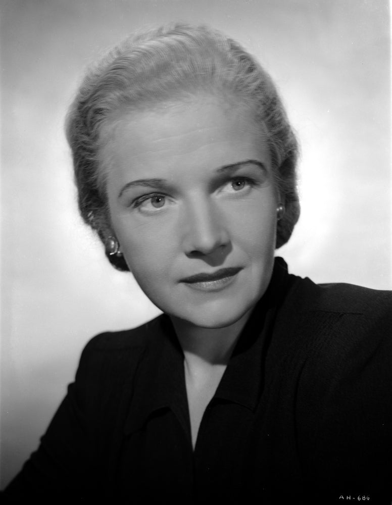 Ann Harding facing left in a black blouse portrait photo print.