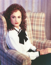 Holly Hunter seated on couch in white dress photo print